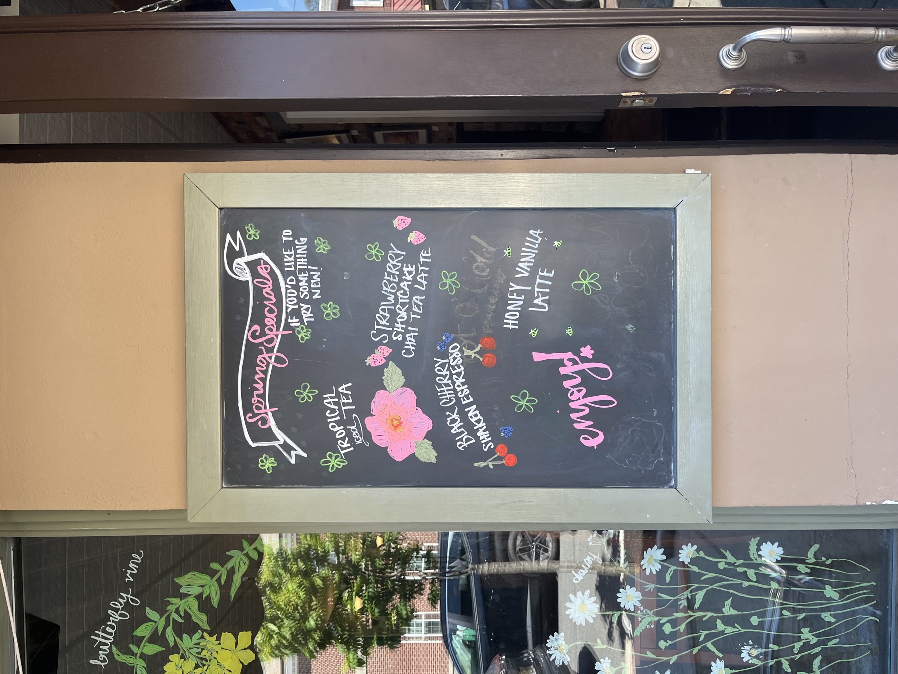 A colorful hand-lettered spring café menu