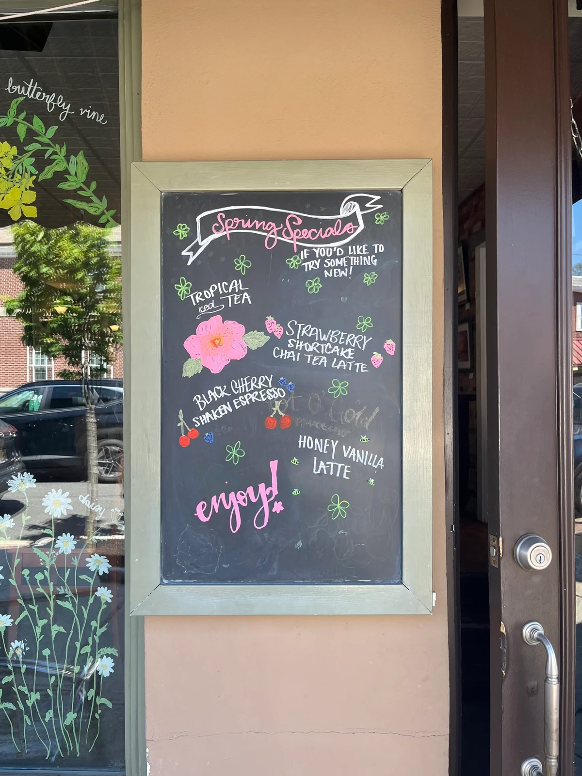 Spring café specials illustrated in pink, white and green chalk